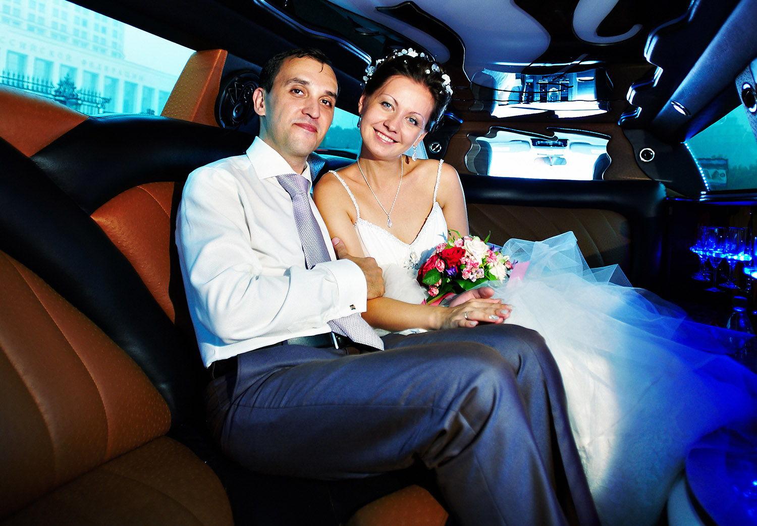 Wedding limo bus Bride and groom in limo bus